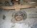 1989 Ford F-150 - The rear axle of a 1989 Ford F-150 is shown with its tire and brake drum missing.