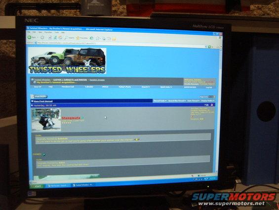 Computer monitor showing the "Twisted Wheelers" website with two off-road vehicles