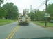 1981 Ford Bronco - A utility bucket truck is seen from behind on a road with a speed limit of 35 mph.