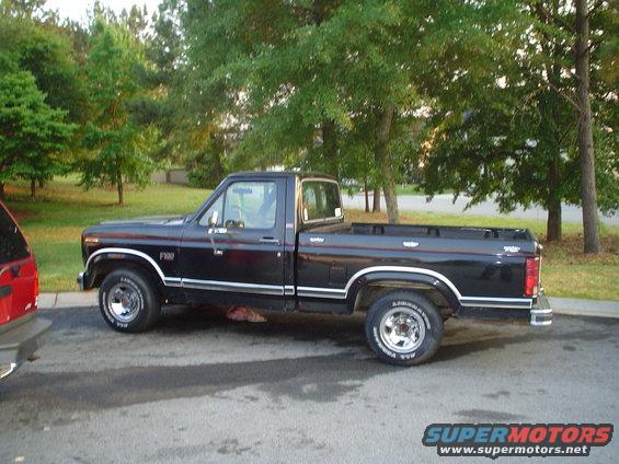 Black 1980 Ford F-150 pickup truck parked on asphalt