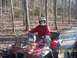 2003 Honda RUBICON - Riding an ATV through a muddy forest trail on a sunny day.