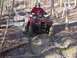 2003 Honda RUBICON - Riding an ATV through a muddy path in a wooded area.