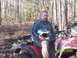 2003 Honda RUBICON - Man on a red ATV in a wooded area, with a date stamp of 02/04/2005.