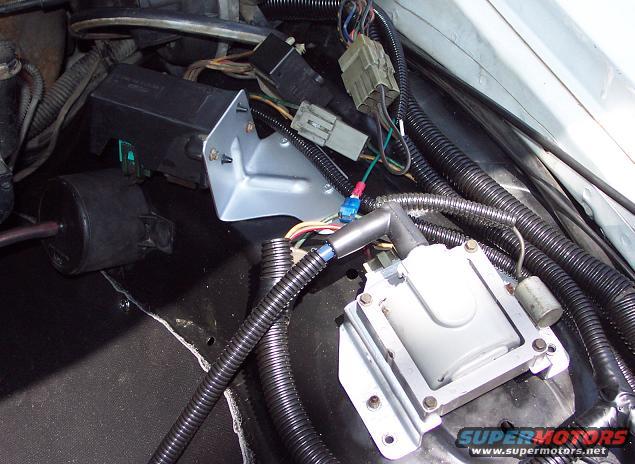 Engine compartment with ignition coil, wiring, and black box