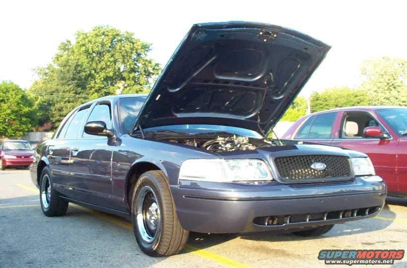 emb-dcmc-frt.jpg These pics were taken the same day at a local Mustang cruise. Note the freshly detailed/clayed/polished Vic.