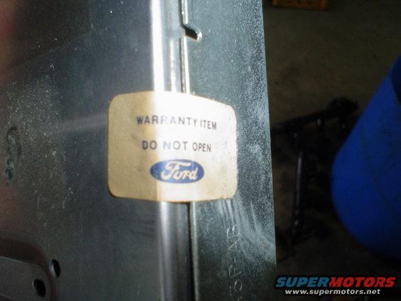 Ford warranty sticker reading "WARRANTY ITEM DO NOT OPEN"