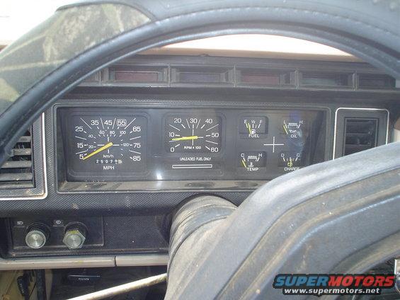 1981 Ford Bronco interior dashboard with speedometer, tachometer, fuel, oil, temp, and charge gauges