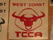 2002 Ford Taurus - Decal shows a bull's head logo with 'WEST COAST' and 'TCCA' text.