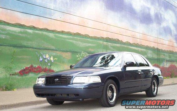 mural-frt.jpg To compliment the shine, I installed the 99 P71 gloss black grille for the following pics. 