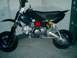 2001 Honda CBR-RR - Side view of a black pit bike with visible engine and suspension components.