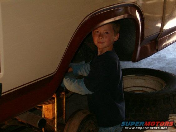 Jake the Gremlin working on the bronco 8 yrs old.