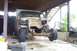 1985 Ford F-150 - This pickup truck is undergoing repairs or modifications, with its front end disassembled.