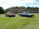 1970 Ford Ranchero - A blue 1970 Ford Ranchero and a red coupe are parked on a grassy lawn in front of a stately manor house.
