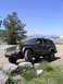 2000 Jeep Cherokee - Jeep Cherokee navigating rocky terrain under a clear blue sky.
