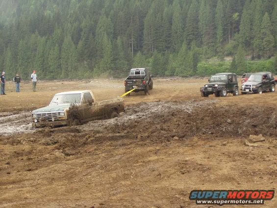 Three vehicles pulling... and the mud's a flyin'!