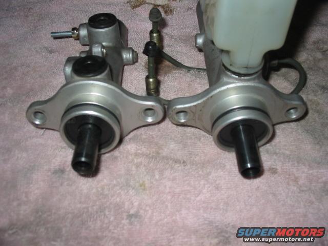 Two brake master cylinders side-by-side