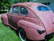 1947 Mercury Sedan - This 1947 Mercury Sedan shows significant rust and faded paint, with whitewall tires.