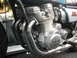 1978 Ford Bronco - Close-up view of a motorcycle engine, showing its exhaust system and branding.