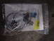 1998 Volkswagen Jetta - A headlight installation kit is shown in a plastic bag with various components and instructions.