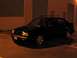 1994 Volkswagen Jetta - This black sedan, likely a 1993 model, is equipped with a roof rack and aftermarket wheels.
