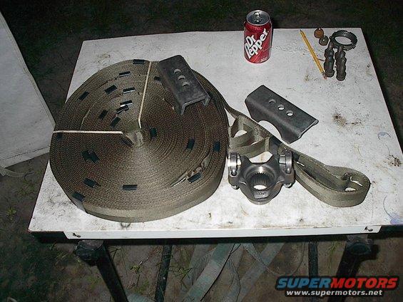 U-joint and straps on a table with a Dr Pepper can