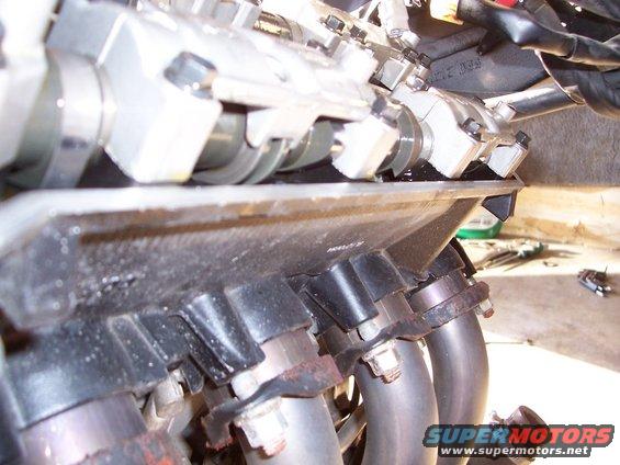 Motorcycle engine valves and exhaust pipes, close-up view