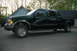 2000 Ford F-350 - This Ford F-350 Super Duty truck is dark green and seen from the side.