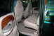 2000 Ford F-350 - The interior of a 2000 Ford F-350 features tan leather seats, wood trim accents, and a spacious cabin.