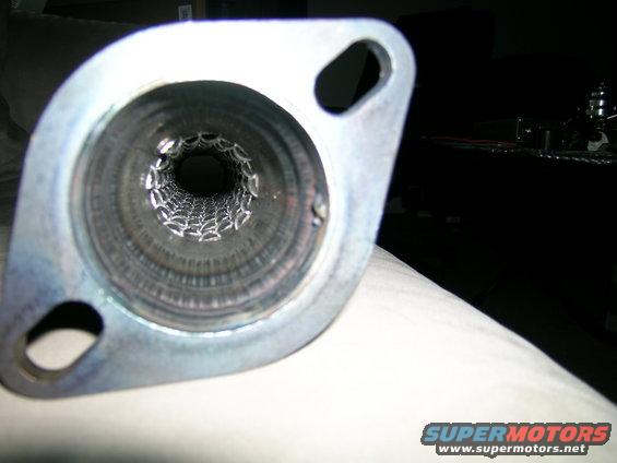 Exhaust pipe with perforated baffle, flange with two bolt holes