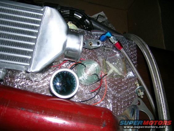 Intercooler and gauge with red pipe
