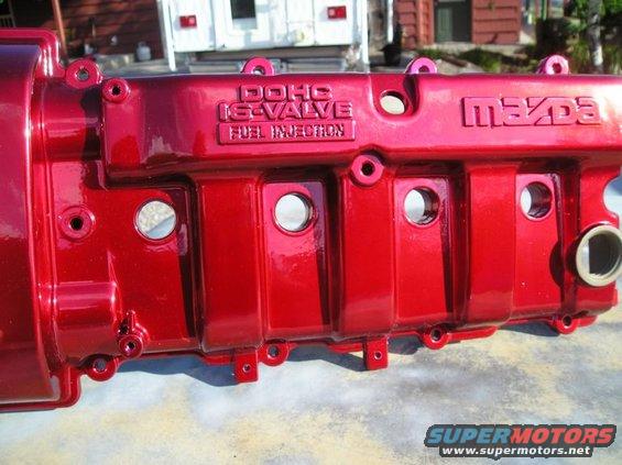Red painted Mazda DOHC 16-valve fuel injection valve cover, close-up