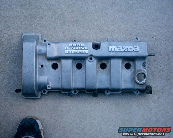 Silver Mazda DOHC 16-valve fuel injection engine valve cover