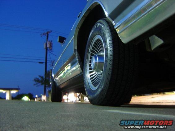 1988 Ford Crown Victoria LTD wheel and lower body panel at night