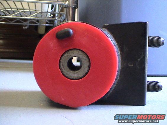 Red bushing and metal bracket with Supermotors.net logo