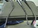 1997 Ford Probe - Three windshield wiper arms are laid out on a textured seat, with a blue towel visible below.