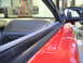 1997 Ford Probe - Interior view of a car's door frame and dashboard, showing part of the side mirror.