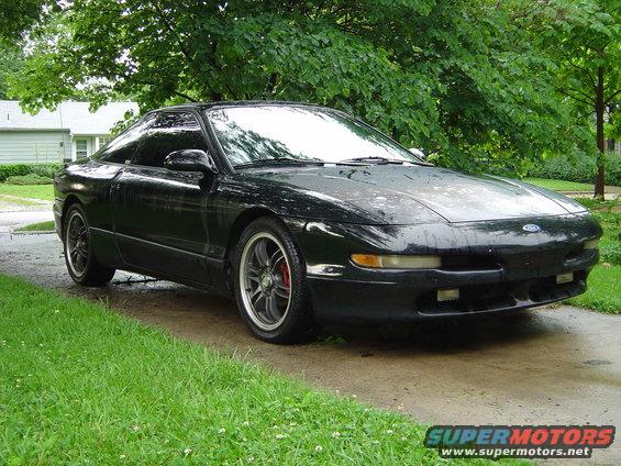 Black 1994 Ford Probe parked on a driveway, 3q front view