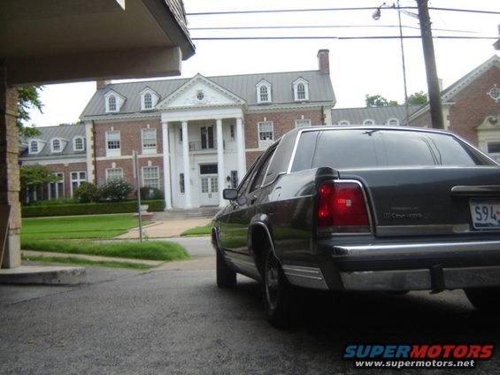 Rear view of a dark 1988 Ford Crown Victoria LTD parked on asphalt