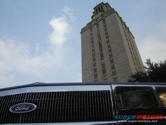 1988 Ford Crown Victoria LTD grille with Ford logo, tall building in background
