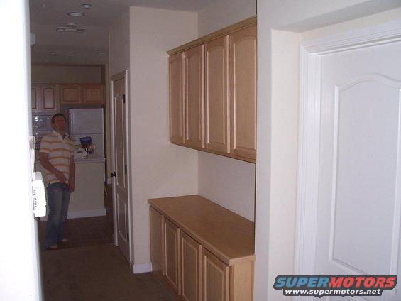 100_3189s.jpg hallway and cabinets looking into kitchen and kenneth