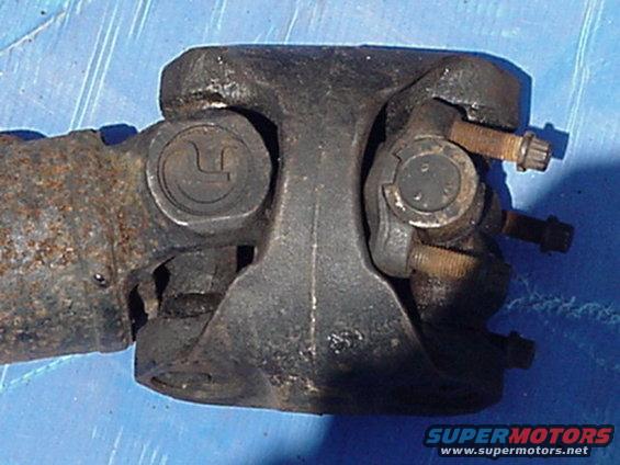 Close-up of a driveshaft U-joint with bolts
