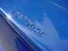 1998 Volkswagen Jetta - Close-up of the 'Carringer' emblem on a blue vehicle.