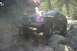1997 Ford Ranger - SUV navigating a rocky trail, likely off-roading in a wooded area.