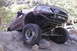 1997 Ford Ranger - A modified 1997 Ford Ranger navigates a rocky trail with another vehicle visible in the background.