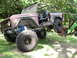 1995 Ford Bronco - This modified 1978 Ford Bronco features a roll cage and oversized tires, indicating it is not a 1995 model.