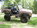 1995 Ford Bronco - This modified Ford Bronco features a full roll cage, racing seats, and off-road tires, suggesting a custom build rather than a stock 1995 m…