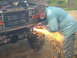 1995 Ford Bronco - A person works on the front of a 1995 Ford Bronco, creating a shower of sparks.