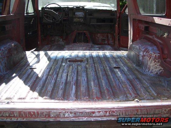 1981 Ford Bronco interior showing stripped-down cab and bed floor