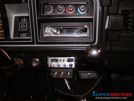 1978 Ford Bronco interior dashboard with Alpine stereo, Cobra CB radio, and chrome shift knob