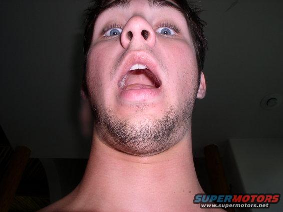Guy looking up at camera with mouth open and eyes wide
